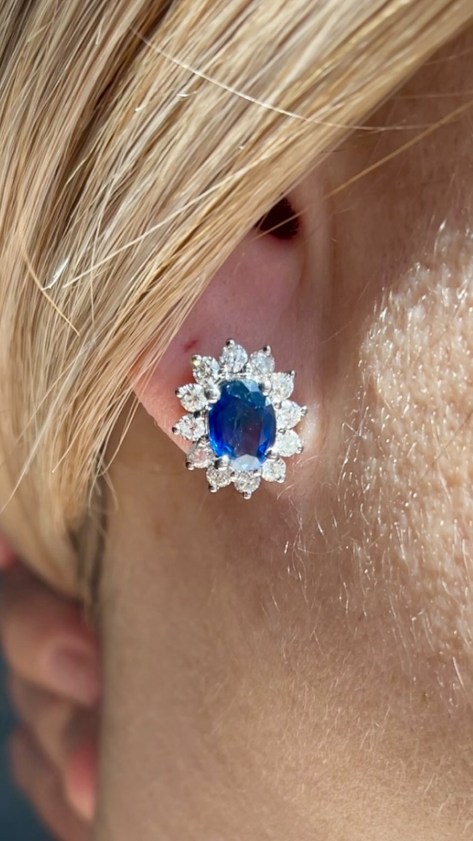 Blue gemstone halo stud earring with diamond surround