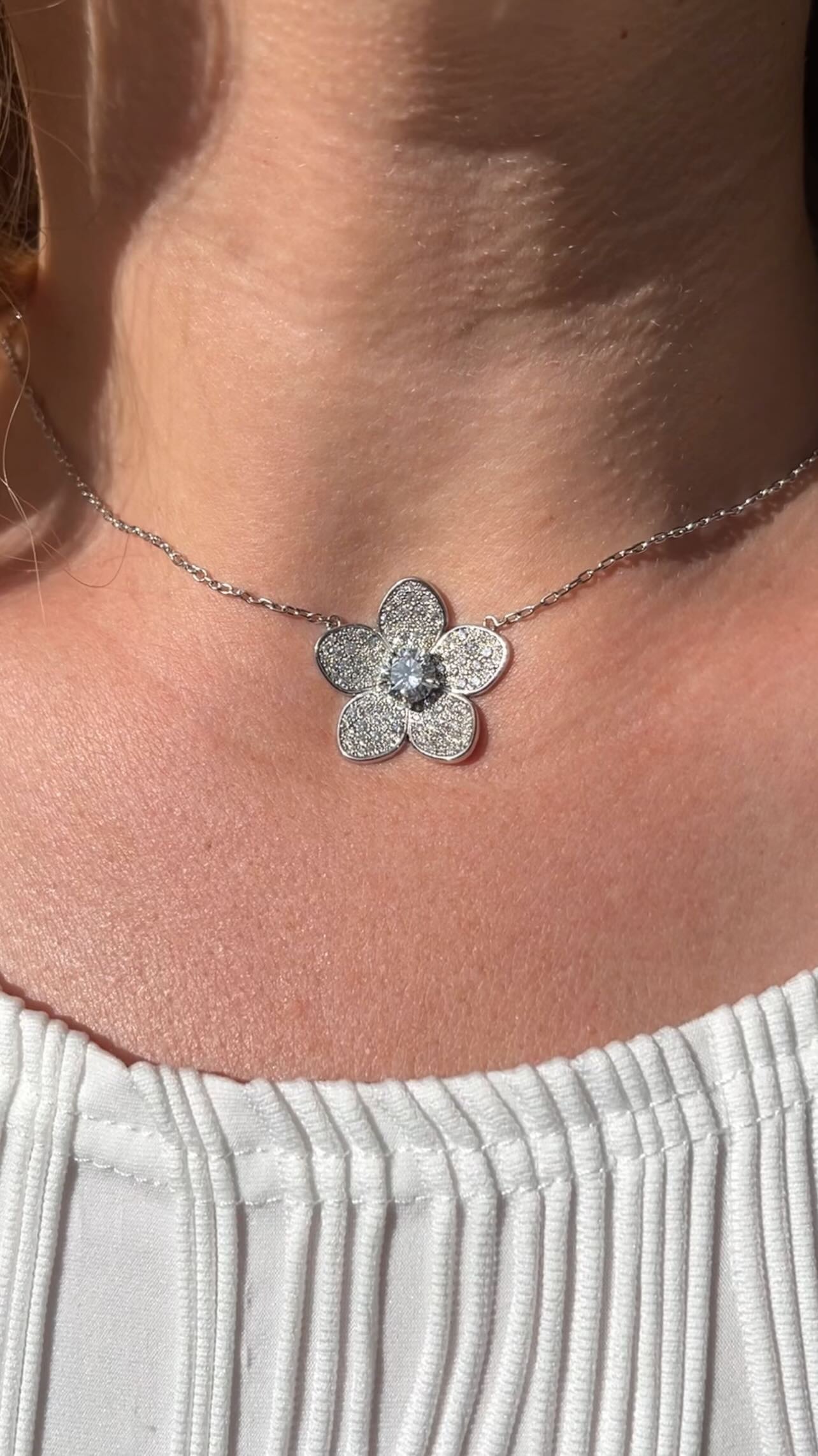 Flower-shaped diamond pendant necklace - delicate floral jewelry design