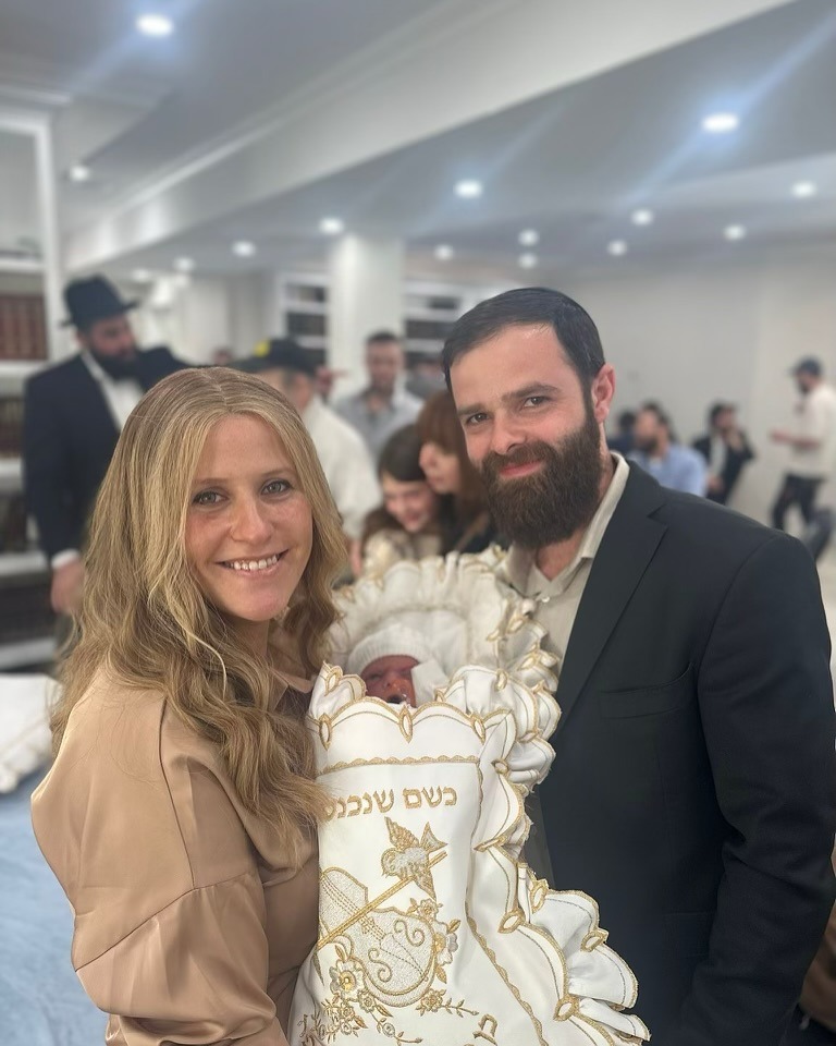 Happy couple with custom engagement ring - Green Jewelers client